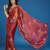 Orange tissue satin embellished saree with unstitched blouse piece.