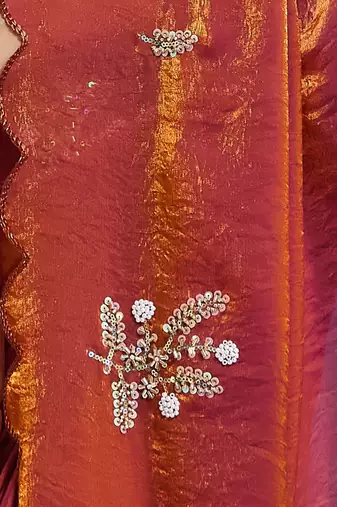 Orange tissue satin embellished saree with unstitched blouse piece.