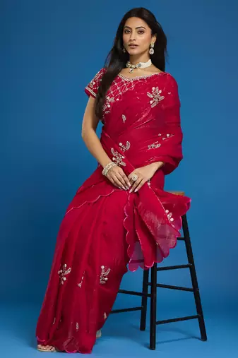 Rani tissue satin embellished saree with unstitched blouse piece.