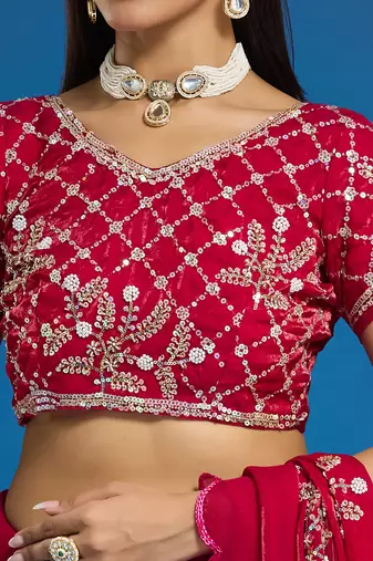 Rani tissue satin embellished saree with unstitched blouse piece.