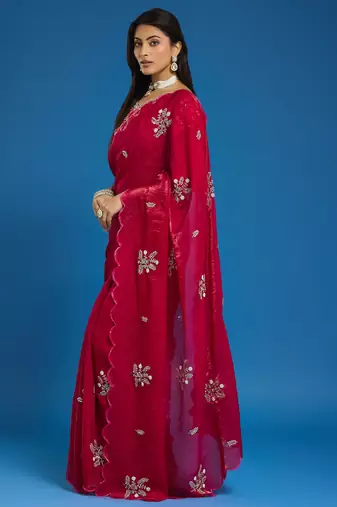 Rani tissue satin embellished saree with unstitched blouse piece.