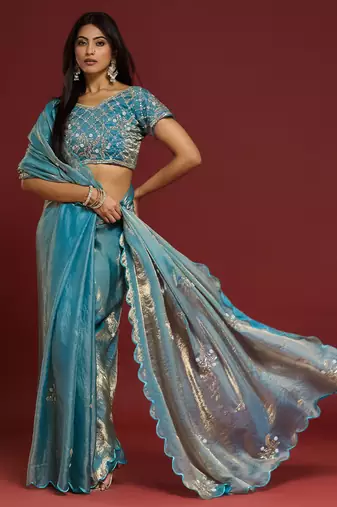 Sky blue tissue satin embellished saree with unstitched blouse piece.