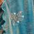 Sky blue tissue satin embellished saree with unstitched blouse piece.