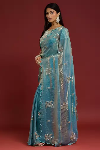 Sky blue tissue satin embellished saree with unstitched blouse piece.