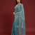 Sky blue tissue satin embellished saree with unstitched blouse piece.
