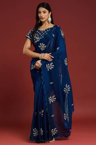 Teal tissue satin embellished saree with unstitched blouse piece.