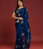 Teal tissue satin embellished saree with unstitched blouse piece.
