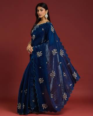 Teal tissue satin embellished saree with unstitched blouse piece. 5
