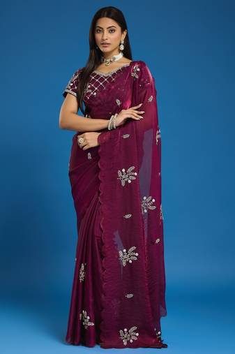 Wine tissue satin embellished saree with unstitched blouse piece.