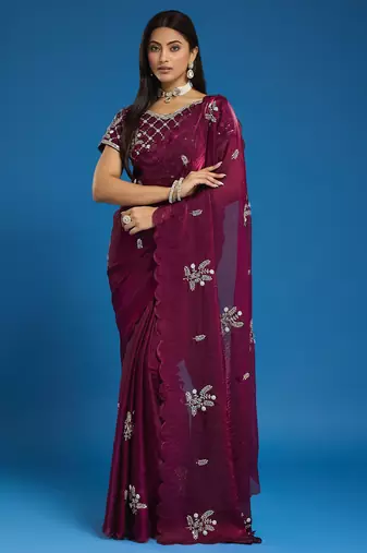 Wine tissue satin embellished saree with unstitched blouse piece.