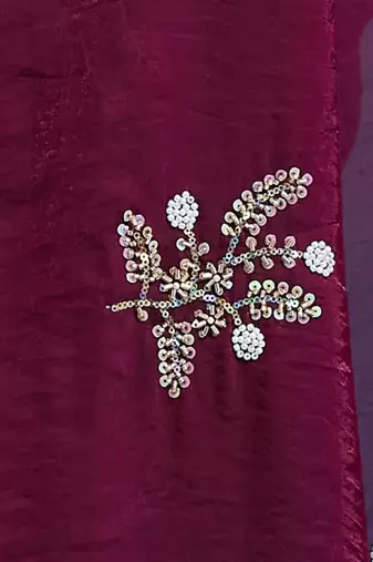 Wine tissue satin embellished saree with unstitched blouse piece.