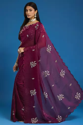 Wine tissue satin embellished saree with unstitched blouse piece.