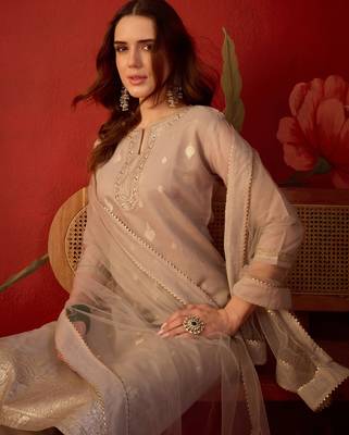 Beige silk blend woven design kurta set with dupatta. 2
