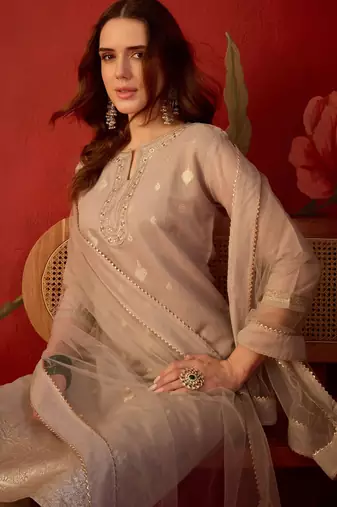 Beige silk blend woven design kurta set with dupatta.