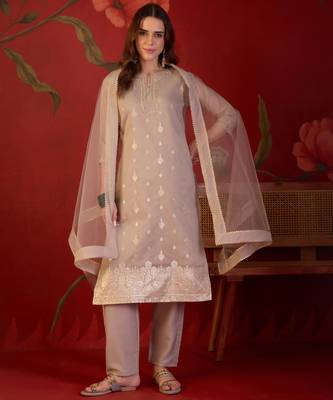 Beige silk blend woven design kurta set with dupatta. 1