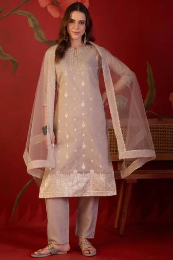 Beige silk blend woven design kurta set with dupatta.