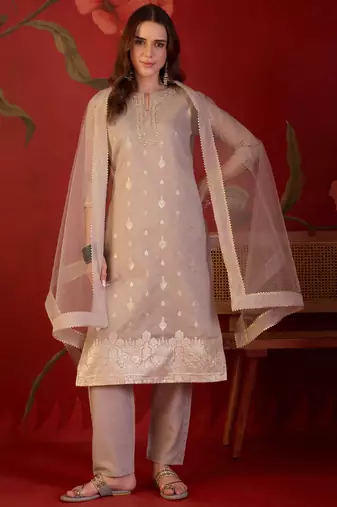 Beige silk blend woven design kurta set with dupatta.