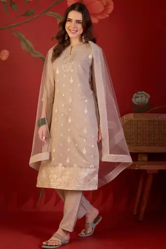 Beige silk blend woven design kurta set with dupatta.