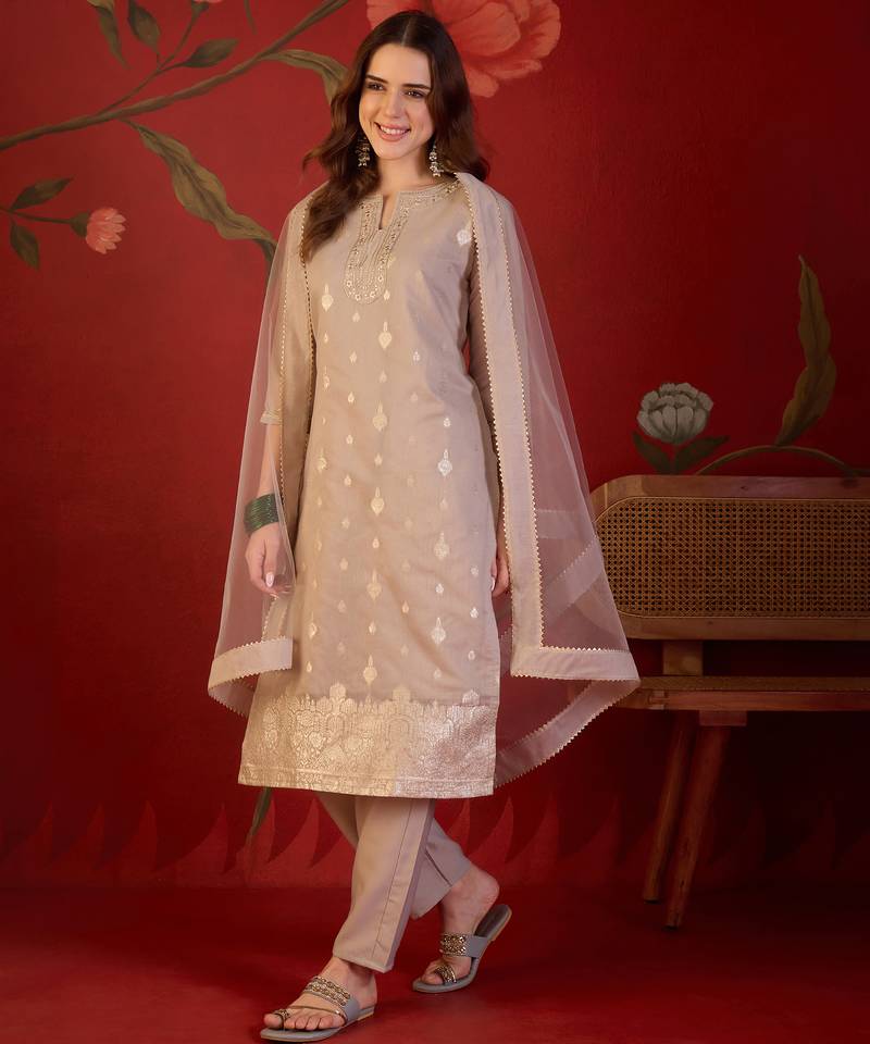 Beige silk blend woven design kurta set with dupatta.