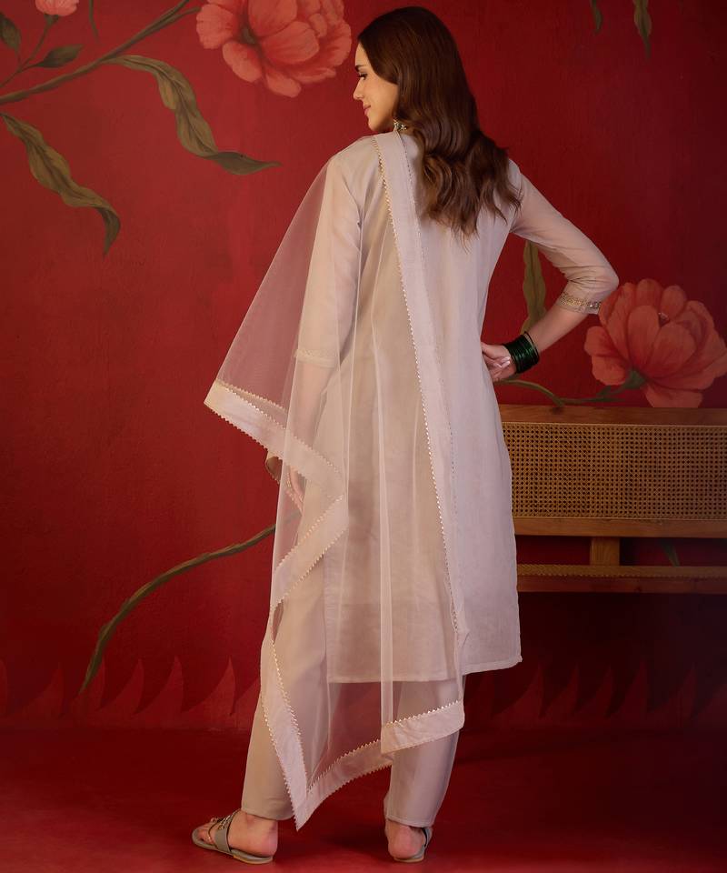Beige silk blend woven design kurta set with dupatta.