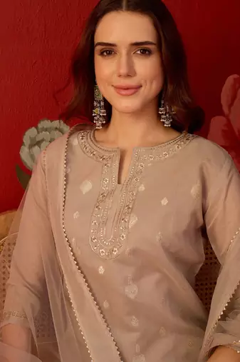 Beige silk blend woven design kurta set with dupatta.