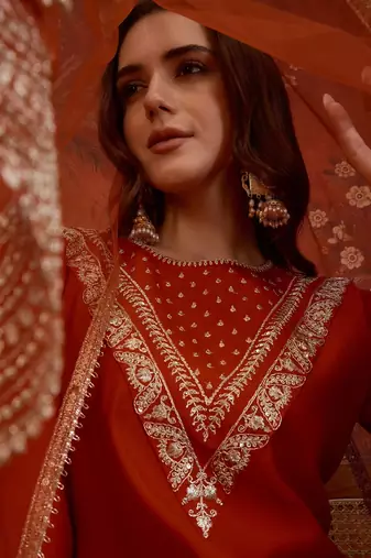 Rust silk blend embroidered kurta set with dupatta.