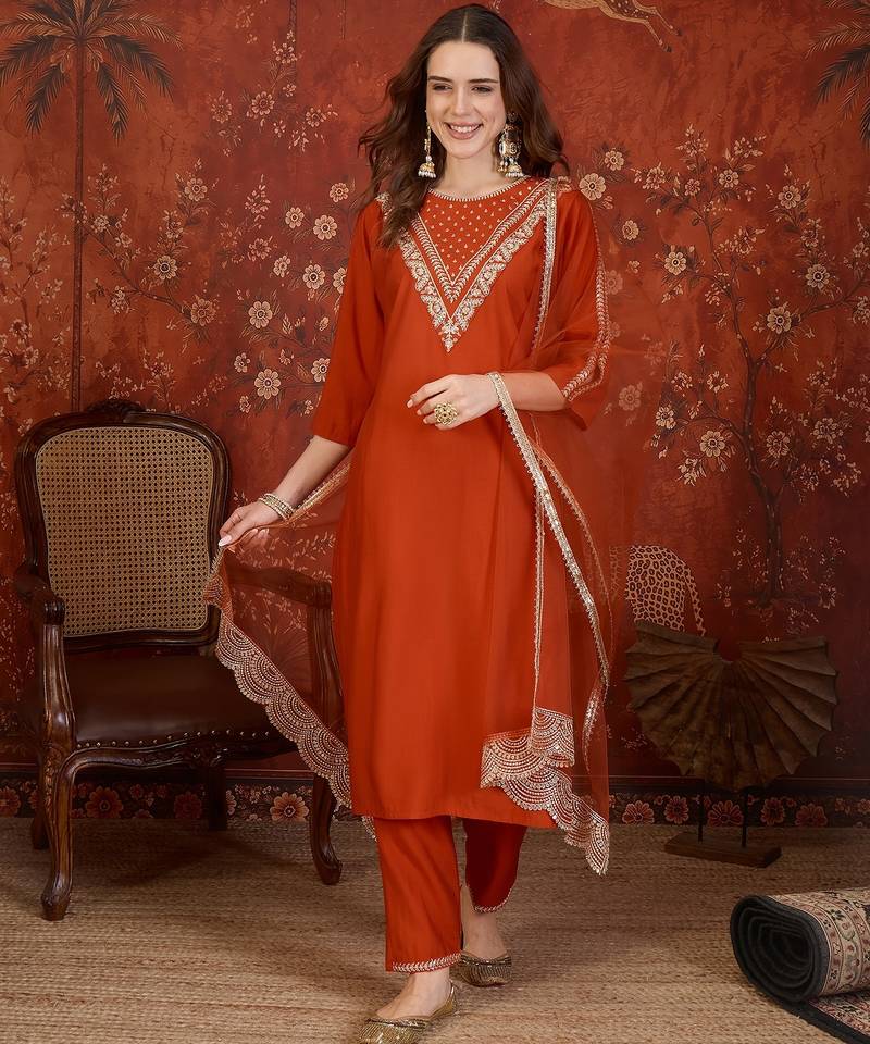 Rust silk blend embroidered kurta set with dupatta.