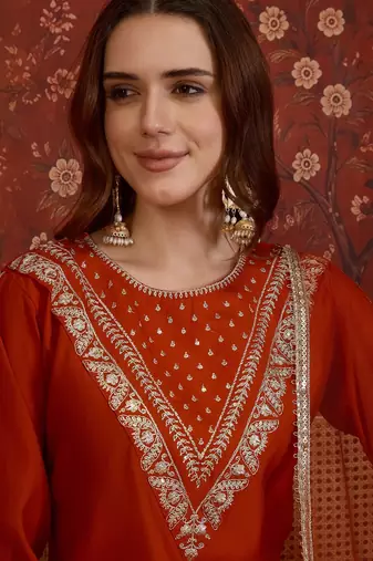 Rust silk blend embroidered kurta set with dupatta.