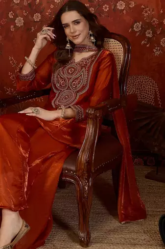 Rust tissue satin embroidered kurta sharara set.