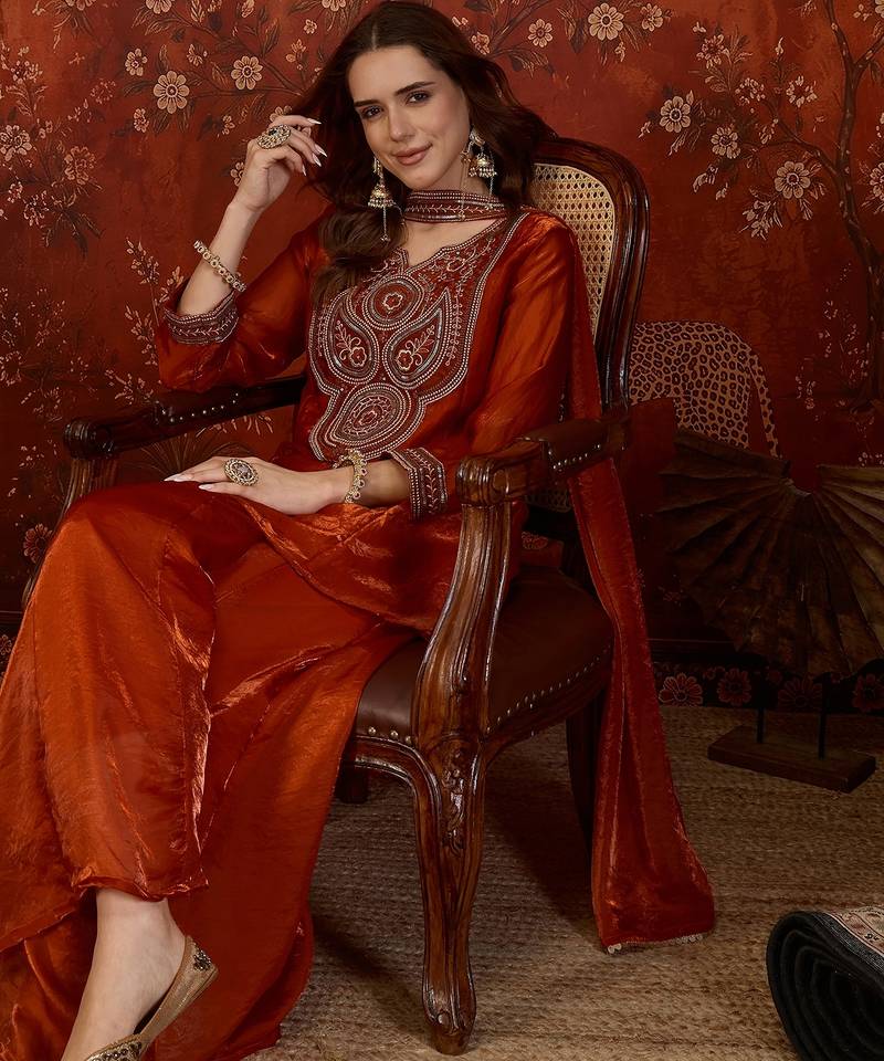Rust tissue satin embroidered kurta sharara set.