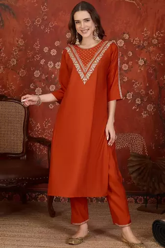 Rust silk blend embroidered kurta set with dupatta.