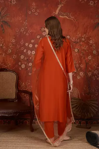 Rust silk blend embroidered kurta set with dupatta.