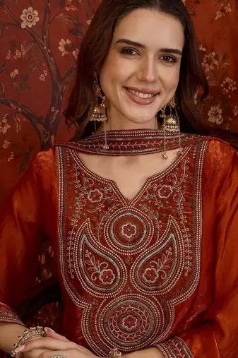 Rust tissue satin embroidered kurta sharara set.