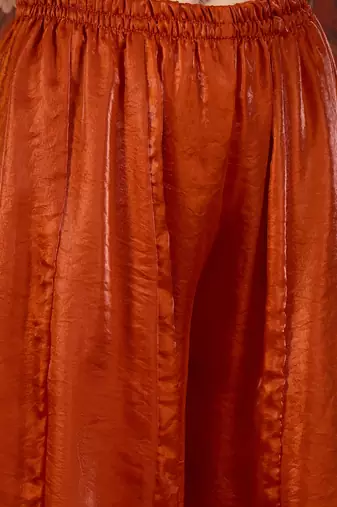 Rust tissue satin embroidered kurta sharara set.