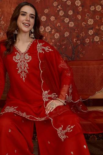 Red silk blend embroidered kurta plazzo set with dupatta.