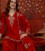 Red silk blend embroidered kurta plazzo set with dupatta.