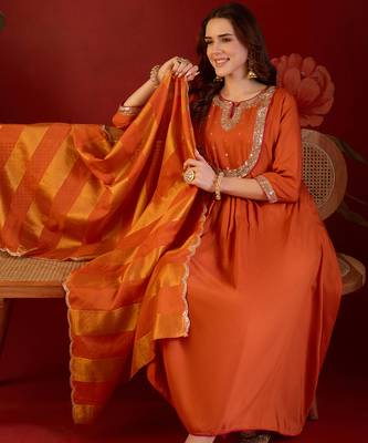 Orange cotton silk embroidered kurta set with dupatta. 1