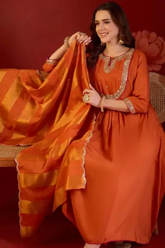 Orange cotton silk embroidered kurta set with dupatta.