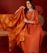 Orange cotton silk embroidered kurta set with dupatta.