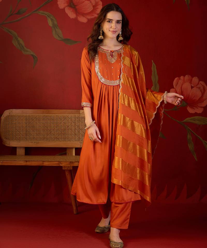 Orange cotton silk embroidered kurta set with dupatta.
