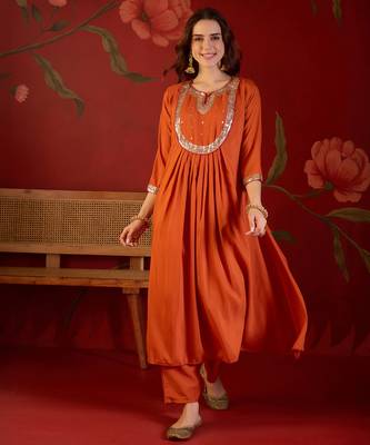 Orange cotton silk embroidered kurta set with dupatta. 4