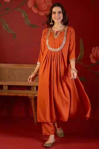 Orange cotton silk embroidered kurta set with dupatta.