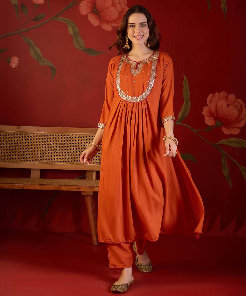 Orange cotton silk embroidered kurta set with dupatta.