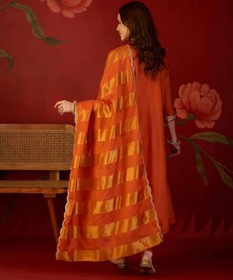Orange cotton silk embroidered kurta set with dupatta. 5