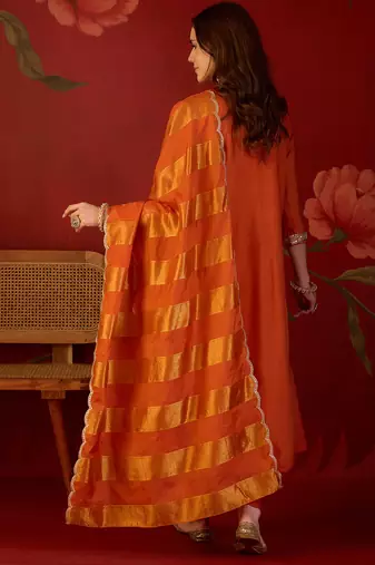 Orange cotton silk embroidered kurta set with dupatta.