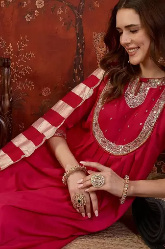 Rani cotton silk embroidered kurta set with dupatta.