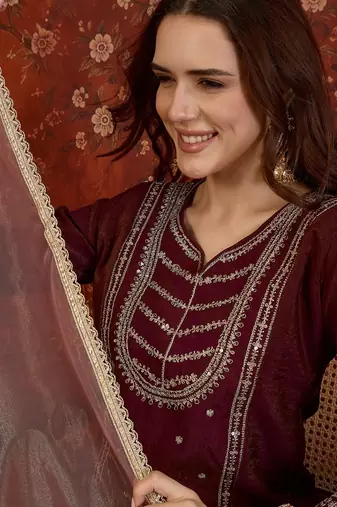 Maroon silk blend embroidered kurta sharara set with dupatta.