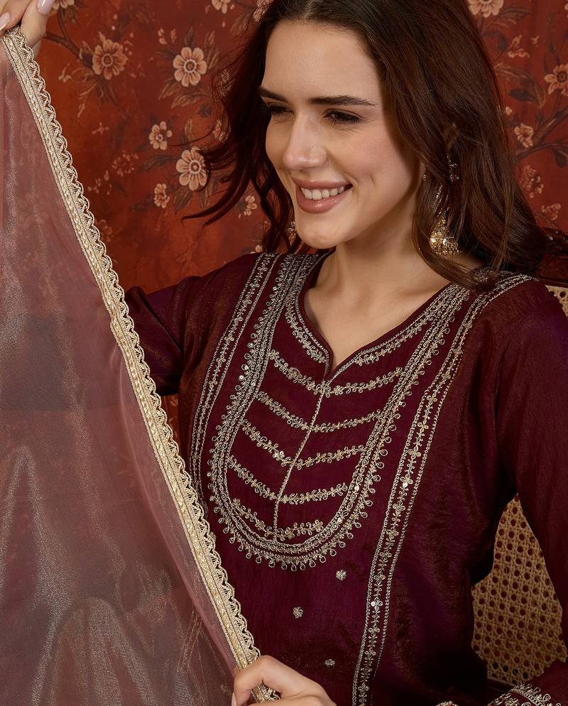 Maroon silk blend embroidered kurta sharara set with dupatta.