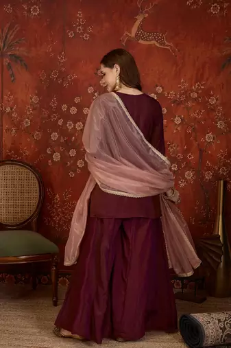 Maroon silk blend embroidered kurta sharara set with dupatta.