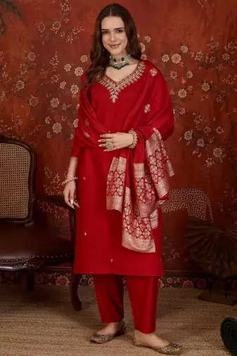 Red silk blend embroidered kurta set with dupatta.